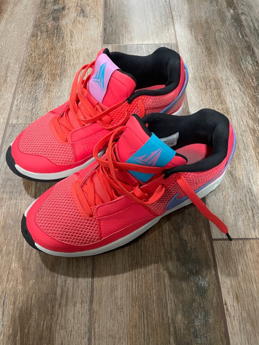 Nike Coral Basketball Sneakers with Blue Accent